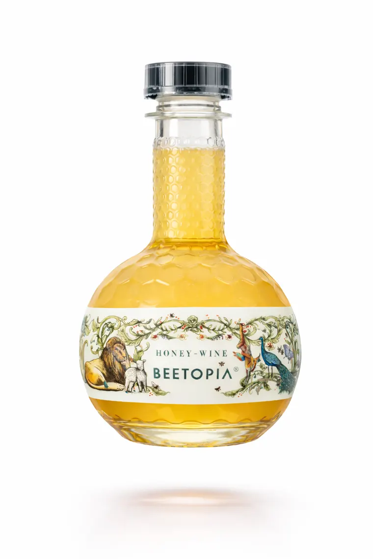 Beetopia honey wine in its honeycomb-textured round bottle
